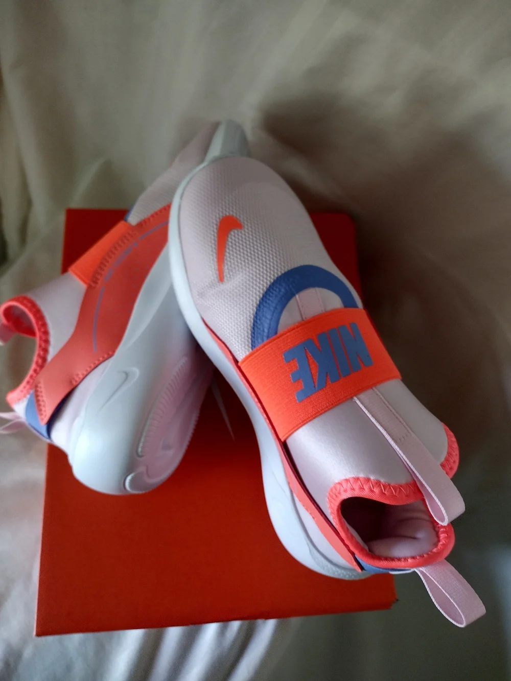 Nike Kids Slip-On Sneakers in White, Coral, Lavender